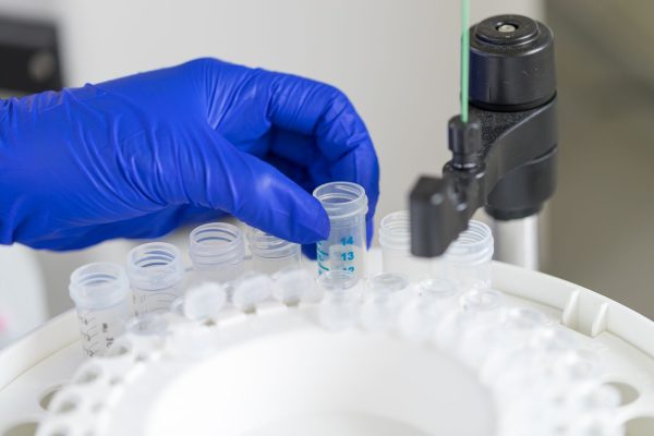 decorative picture of scientist holding tube